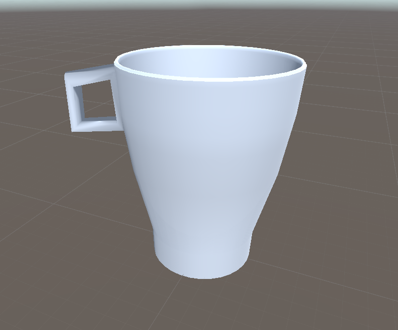 A first attempt at modelling a mug in 3D. The handle is too square and does not look like the real object.