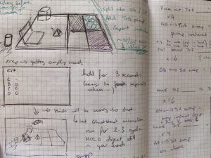 A close-up picture of my notebook, showing a sketch of the board and objects I have used in previous studies and lots of scribbled notes covering the page around it. 