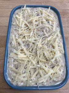 A lasagne before its cooked in the oven.