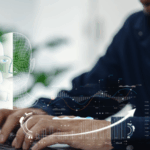 A person types on a laptop, with graphics and data overlaid