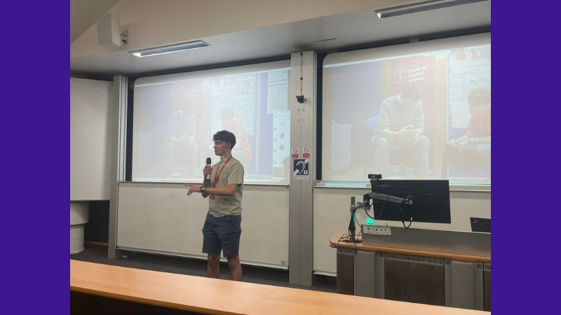 A photo of Noah Tucker giving a presentation