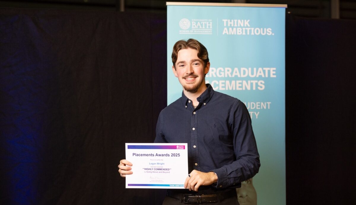 A photo of Logan Wright collecting his award