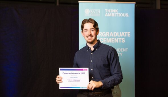 A photo of Logan Wright collecting his award