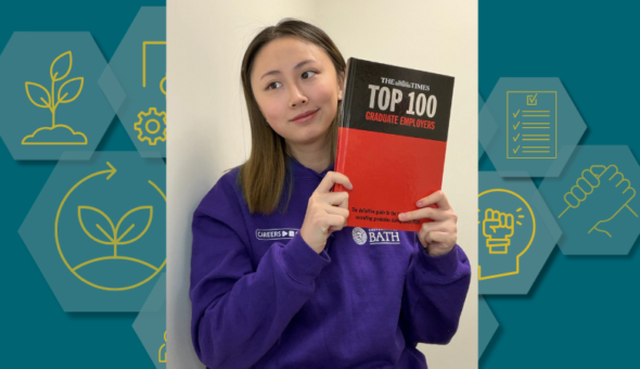 A photo of Dorothy with a copy of The Times Top 100 Graduate Employers