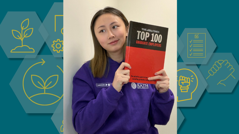A photo of Dorothy with a copy of The Times Top 100 Graduate Employers