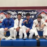 A photograph of Bernard Fowler with his Jiu Jitsu team