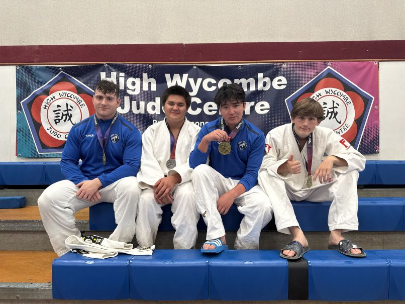A photograph of Bernard Fowler with his Jiu Jitsu team