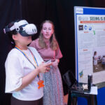 Emma Harrison with another student who is trying out VR