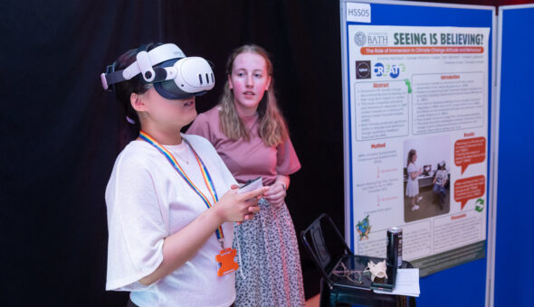 Emma Harrison with another student who is trying out VR