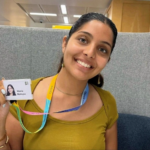 A photograph of Maaria Mamujee with her Aviva ID card