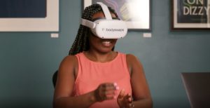 Bodyswaps woman wearing a VR headset.