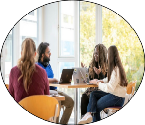 Four people sat around a table talking