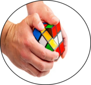 Hands playing with a rubiks cube