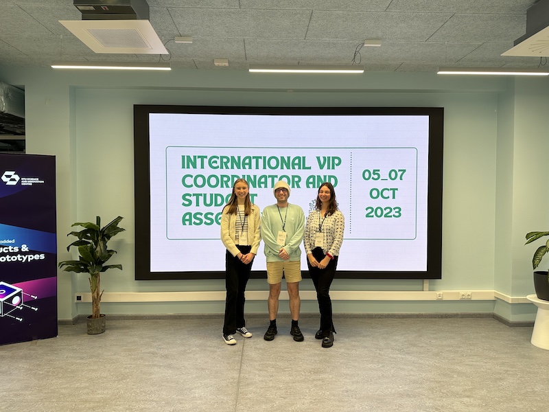 three students stood in front of VIP Conference sign