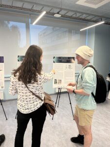 two Students looking at poster