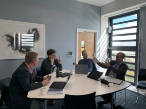 Members of staff around tables sat down