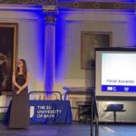 Vice Chancellor and SU Officer (Education) on Stage with Award