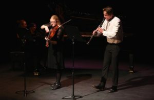 two Edge Arts scholars playing violin and clarinet