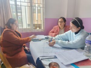 3 People having a discussion on a table