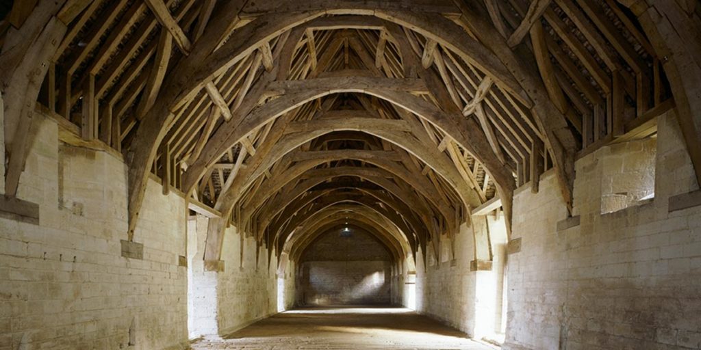 The stunning cruck roof of the Tithe Barn in Bradford-on-Avon, Somerset, UK. Courtesy of English Heritage.