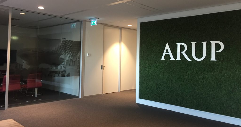 Office with a green grass Arup banner