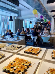 People enjoying sushi at a Japanese themed lunch buffet.