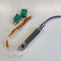 Off-the-shelf air heater with attached wiring and sensors used for product development.