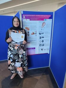 Prize winner Mahnoor posing with her poster