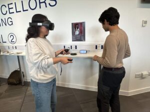 Adi Vatsyayana showcasing the VR developments of CBio to Jing Zhang