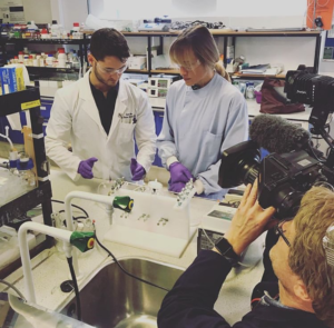 Marianne and Scott working together in the lab.