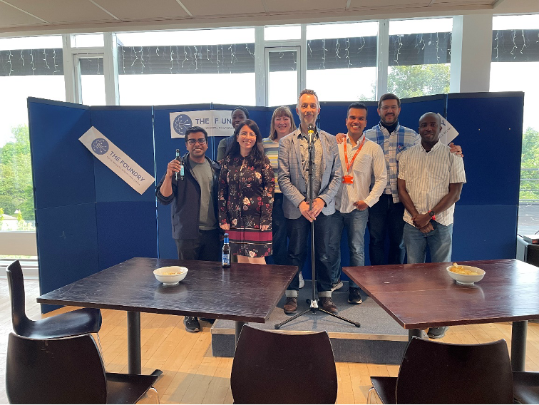 PhD students, researchers and academic from the University of Bath stood on stage in the Claverton rooms.