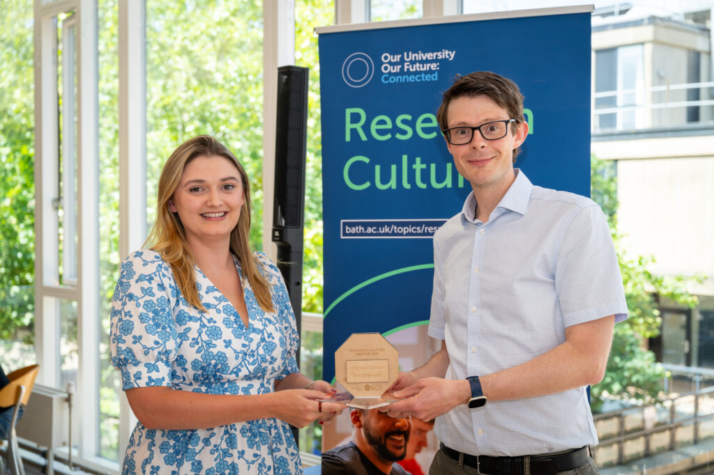 Ellie Smallwood presented with her trophy, by Professor Richard Burke
