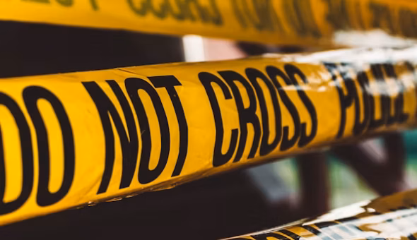 Image shows police do not cross banner