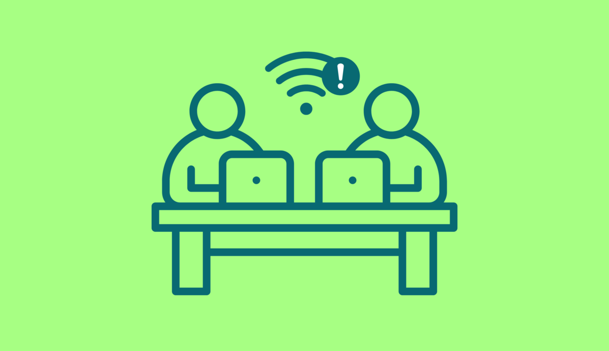 Icon of two people working at a desk with limited wifi