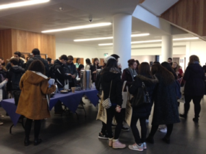 Newly arrived students getting to know each other over tea and coffee. 