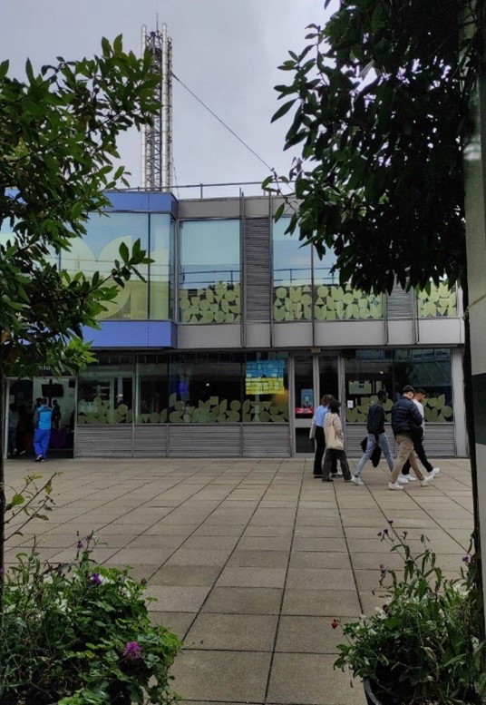 view of the SU building with a Ukrainian flag in the window