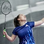 A sports scholar playing tennis