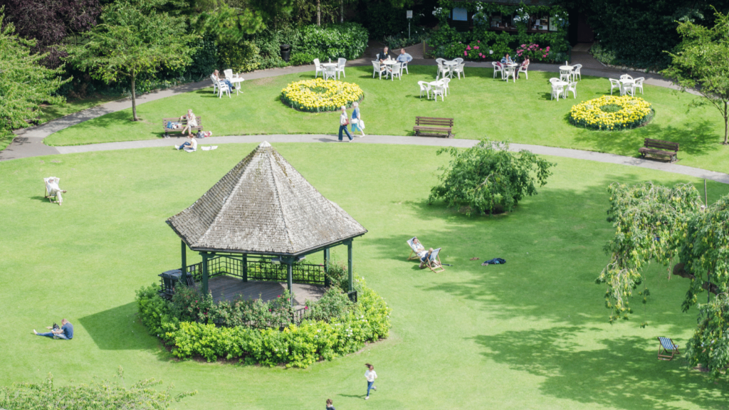 A pleasure garden on a sunny day with a pointed gazebo