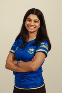 Female cricket player smiling to camera 