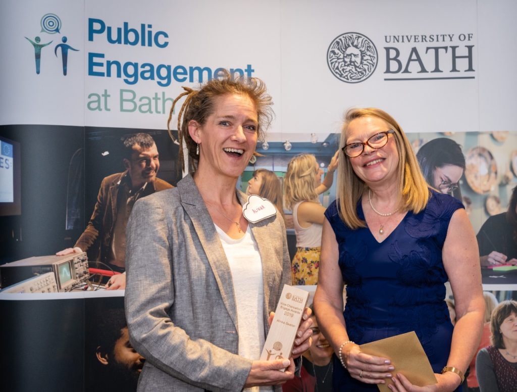 University of Bath researcher Alinka Gearon with Mrs. Margaret White on the award podium during the award presentation 