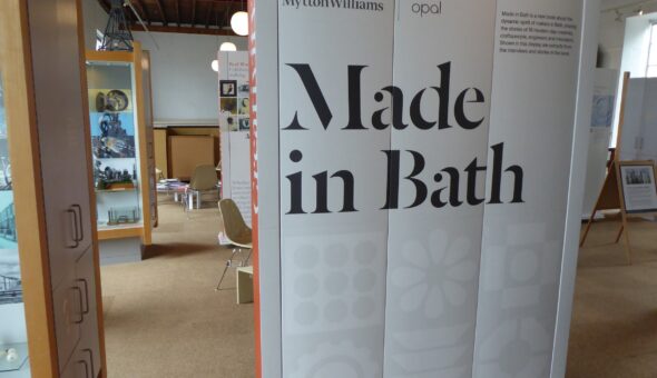 A view into an Exhibition at Holburne Museum. A large screen reads "Made in Bath