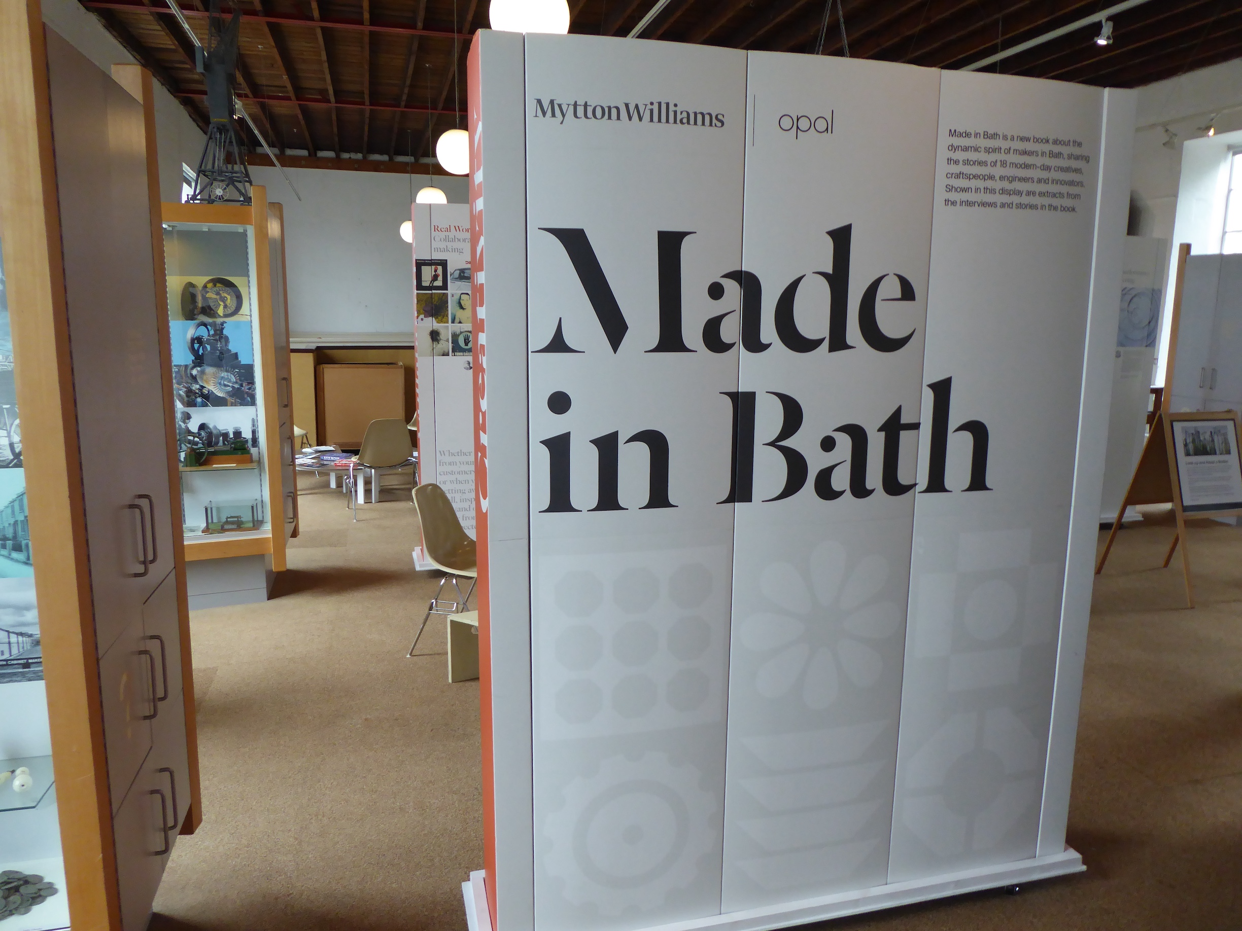 A view into an Exhibition at Holburne Museum. A large screen reads "Made in Bath