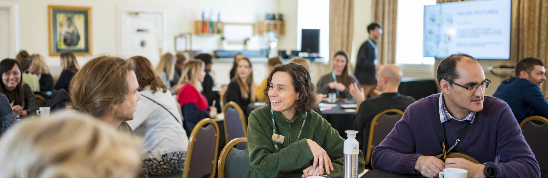 A group of Communicate conference attendees in discussion