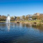 A long-distance view of the University of Bath campus, focusing on the fountain.