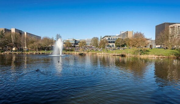 A long-distance view of the University of Bath campus, focusing on the fountain.