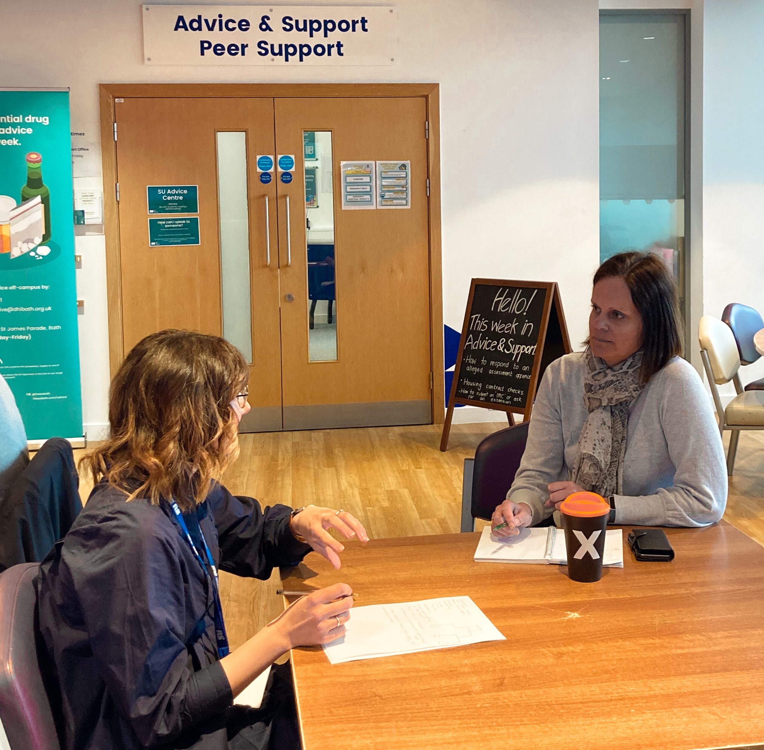 Cassie and Helen meeting outside the SU Advice Centre