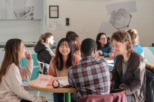 Students sat around a table at the Language Café 