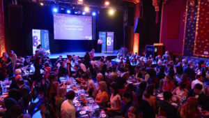 Image of guests seated at tables at the Doctoral Research Celebration Event 2025