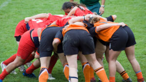 Female athletes in a rugby scrum