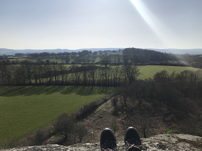 Me sat on top of a tor looking out over Dartmoor